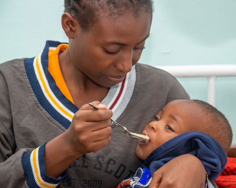 A Tanzanian mother feeding her baby