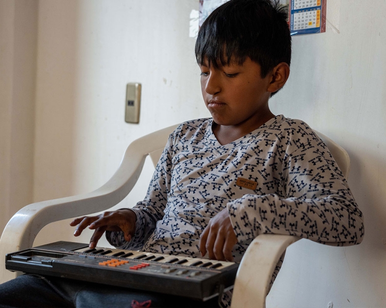 Luis playing the keyboard