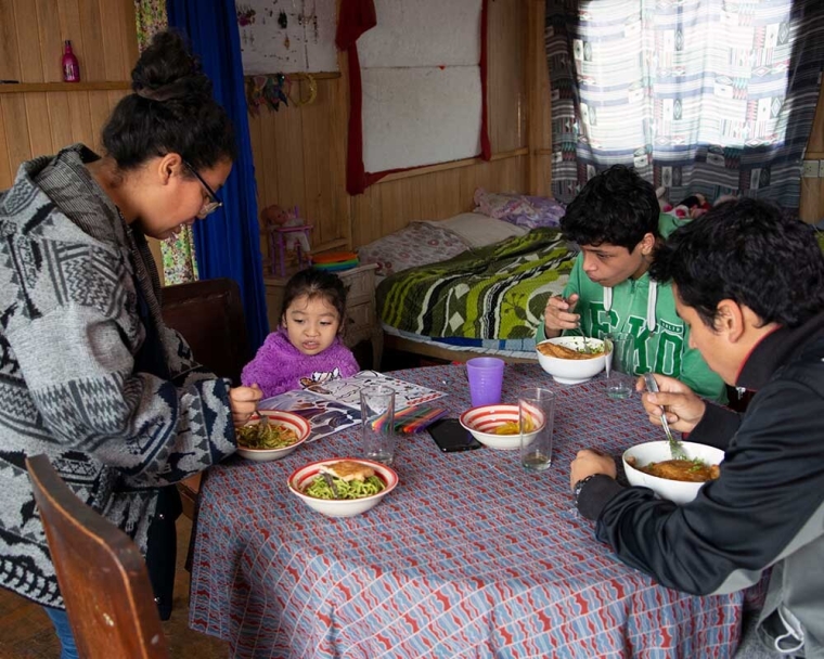 Itzayana eating dinner with her family after cleft surgery