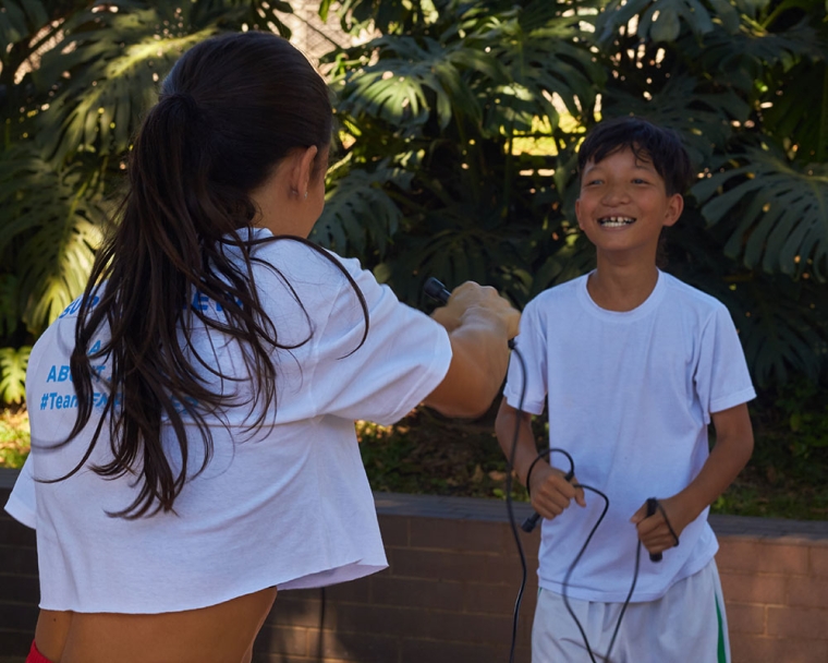 Jennifer Jacobs teaching Smile Train patient how to jump rope