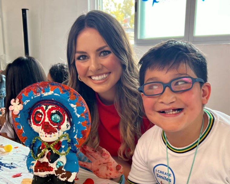 Tammy with a Mexican mask, smiling with a patient