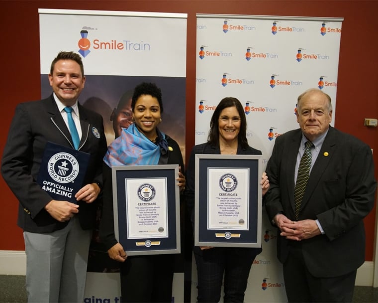 Guinness World Records adjudicator smiling with Susannah Schaefer, Erania Brackett and William Wallace