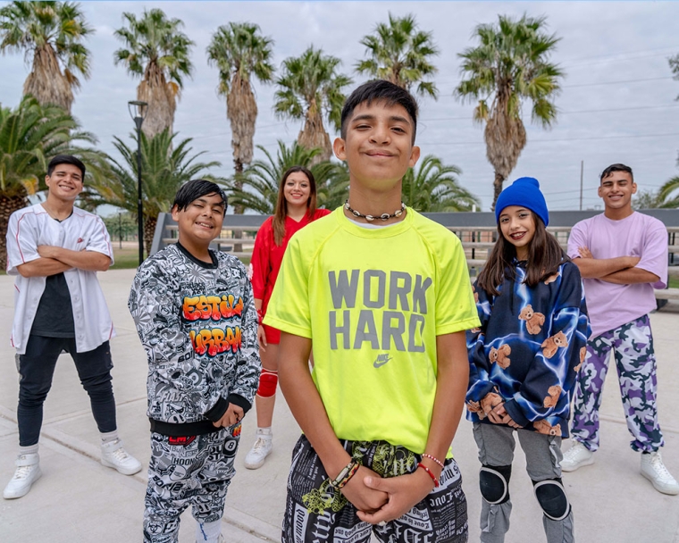 Bautista smiling and posing with his dance academy