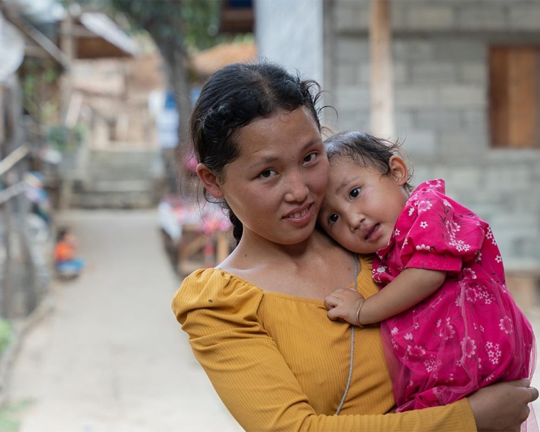 Ming Lao holding Nalee after her cleft surgery