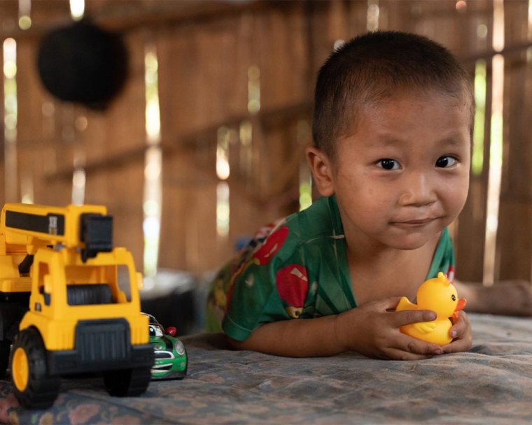 Jingtee playing with a rubber duck and his toys after his cleft surgery