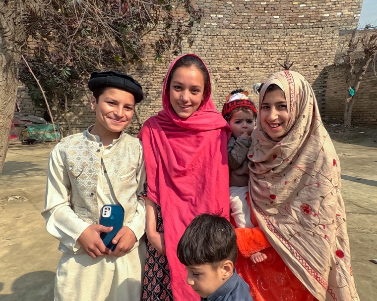 Sheema smiling with her cousins after cleft surgery