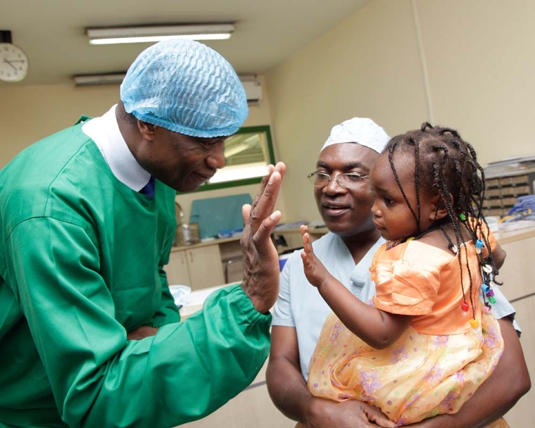 Dikembe at his beloved hospital with cleft patient