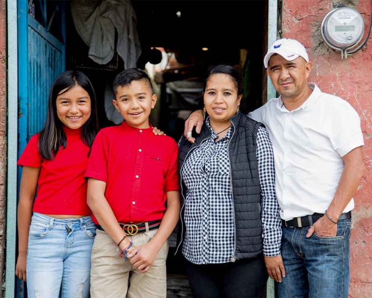 Jesus smiling with his family after cleft surgery