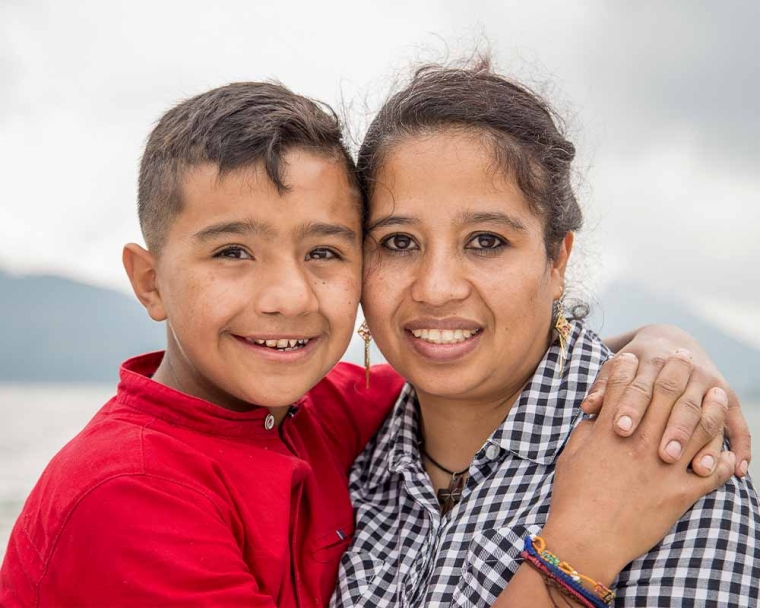Jesus smiling with his mother after cleft surgery