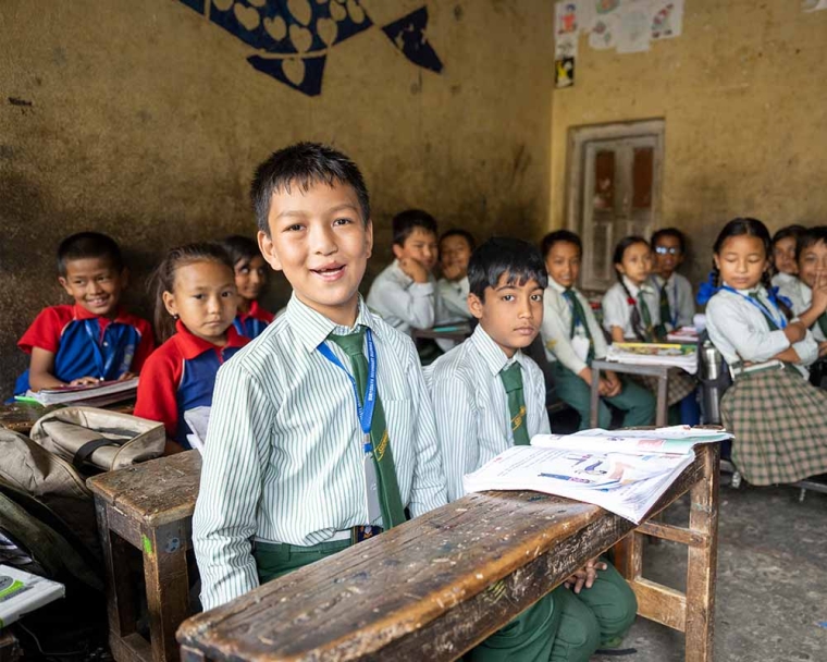 Pema smiling at school after cleft surgery