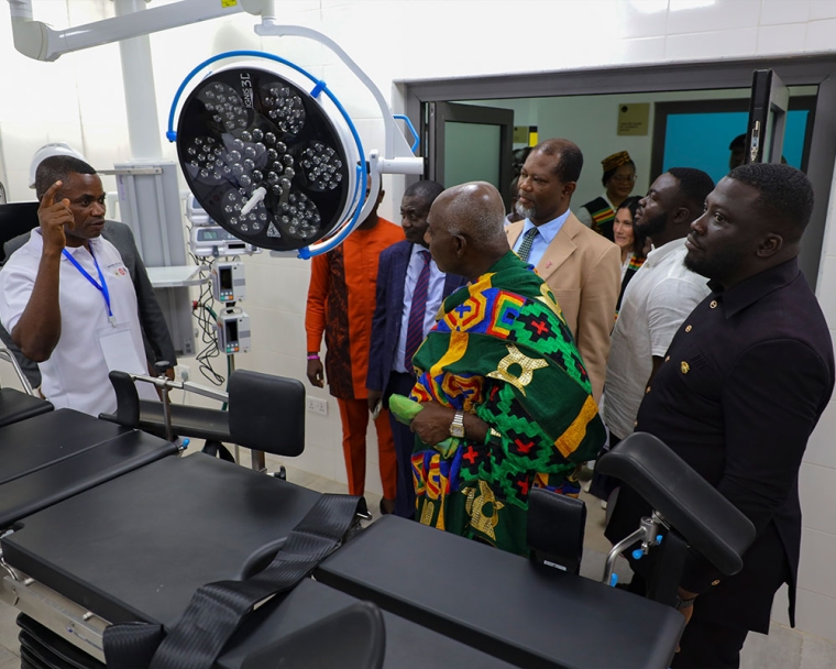 Dignitaries visit an operating room during a tour of the new center