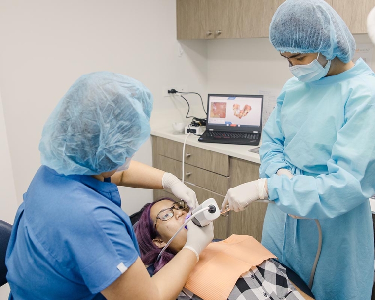 Dentists using imaging technology on cleft-affected patient